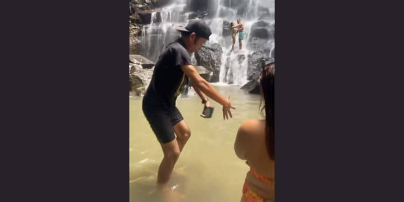 Couple in Bali Receives Bonus Lesson in Waterfall Poses from Tour Guide