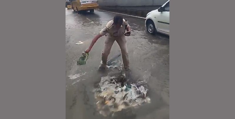 Traffic Cop Goes Beyond Duty to Clear Flooded Road in Hyderabad
